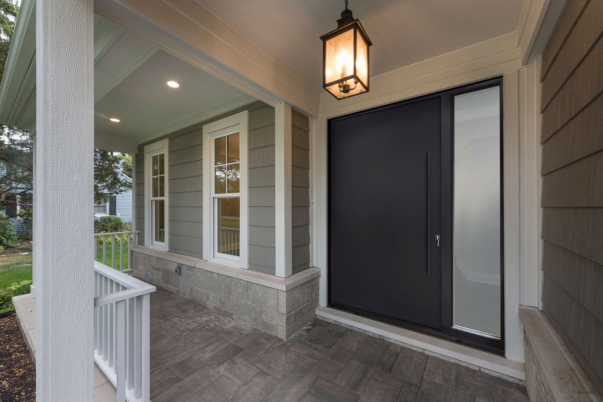 Exterior doors opening to a garden patio with sleek contemporary design.