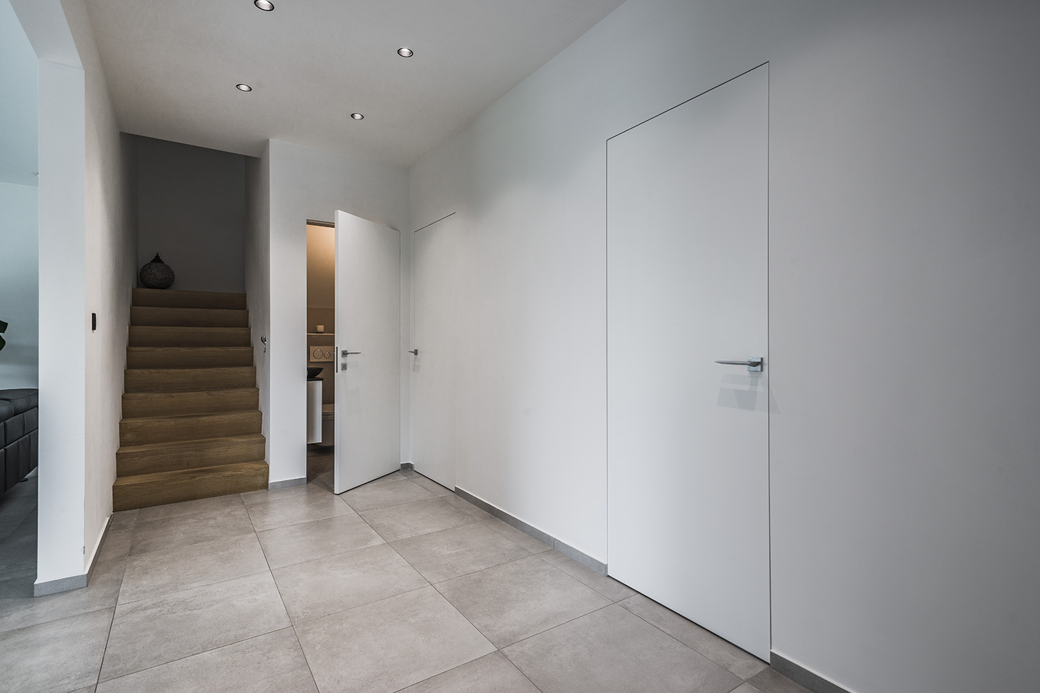 Sleek wood Invisible Door creating a seamless passage in modern office