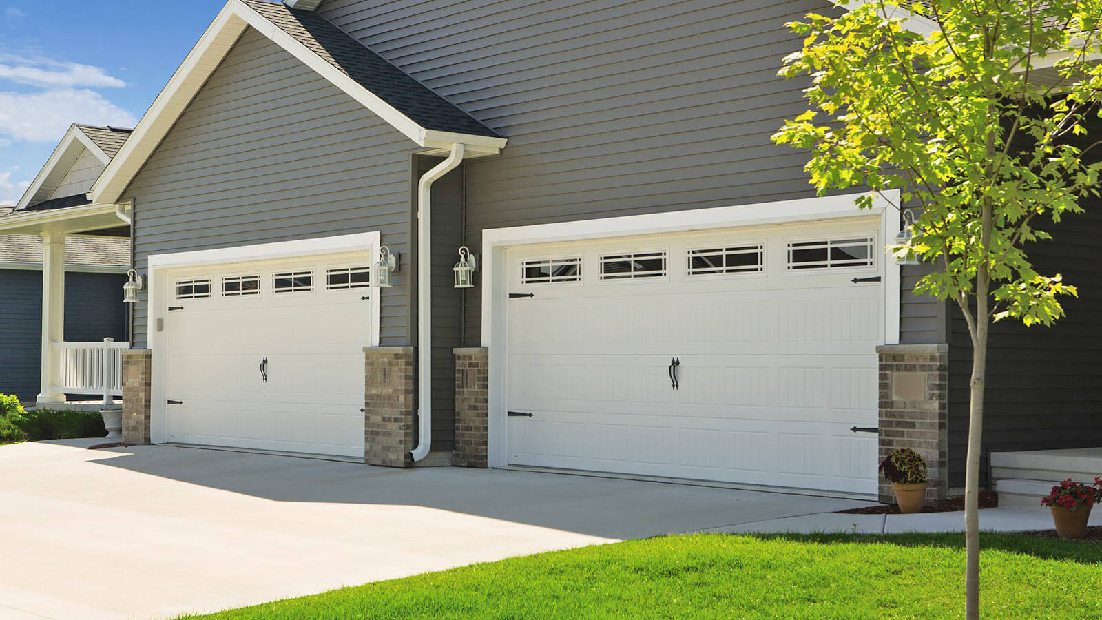Garage door installation service with professional technician at work.