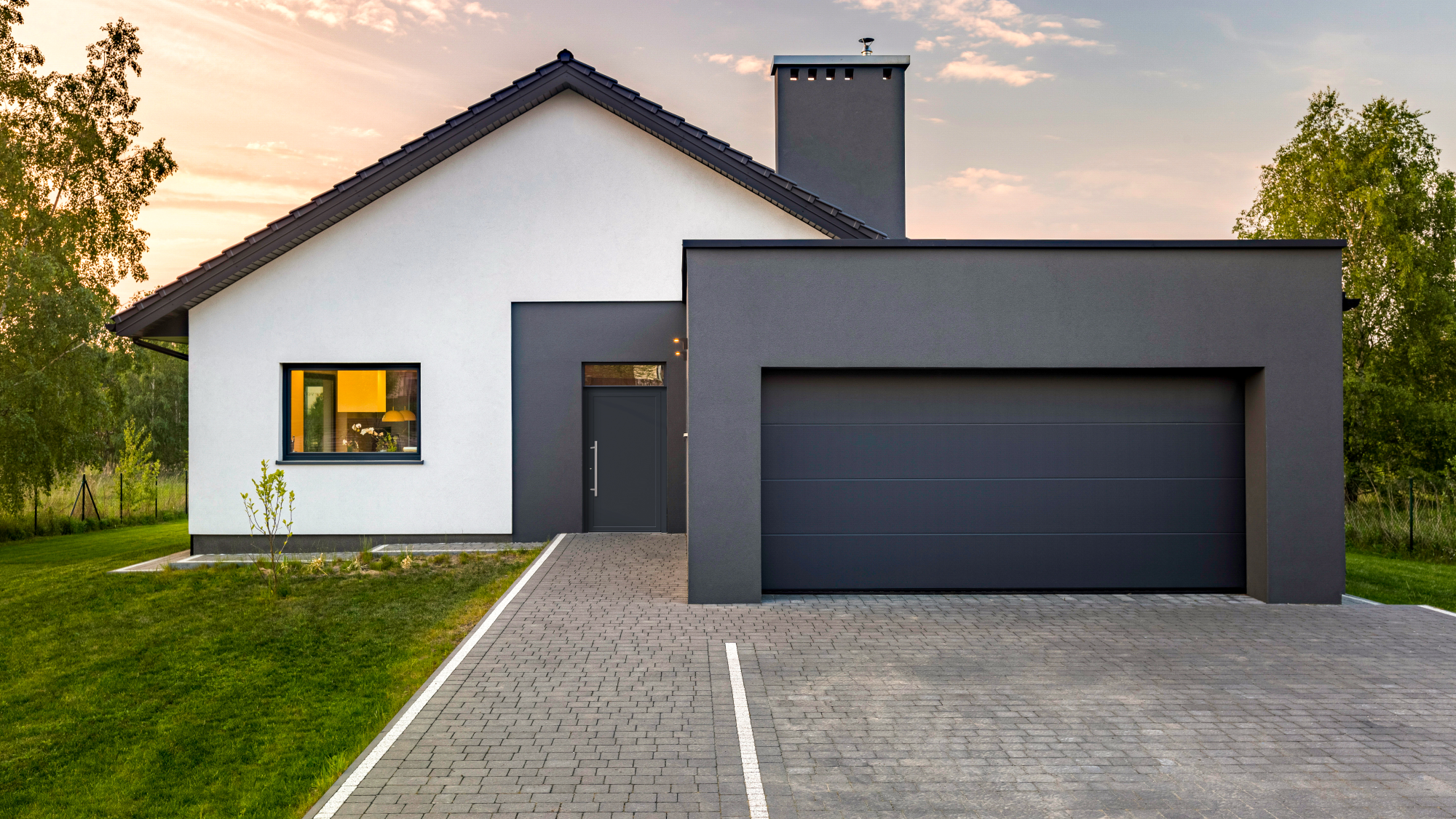 Rustic wooden garage door adding charm to a countryside home.