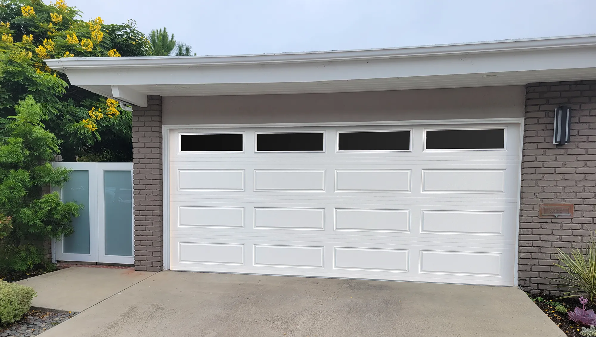 Energy-efficient insulated garage door for better temperature control.