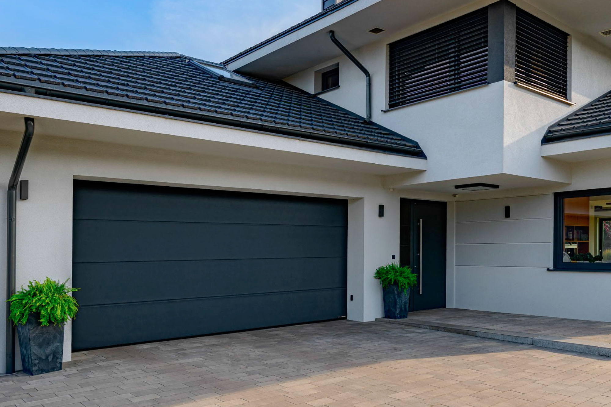 White garage door complementing a contemporary suburban house.