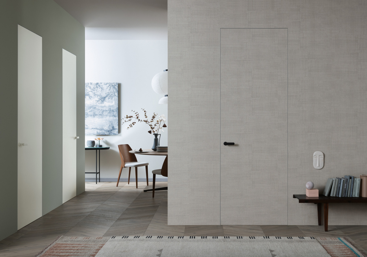 Minimalist living room featuring a hidden ghost door for a clean design look.